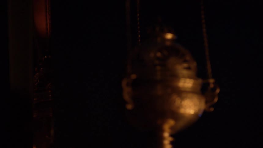 An urn is in a dark area