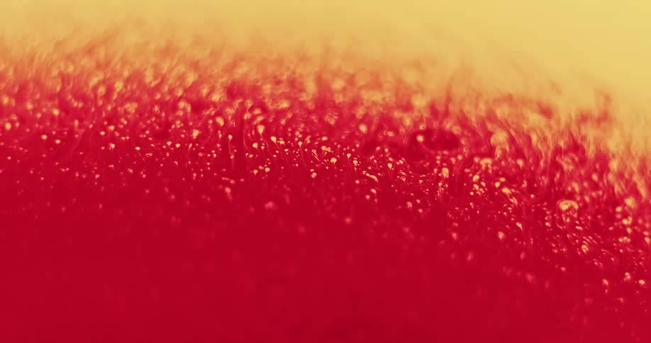 Close up view of paint mixing together is displayed