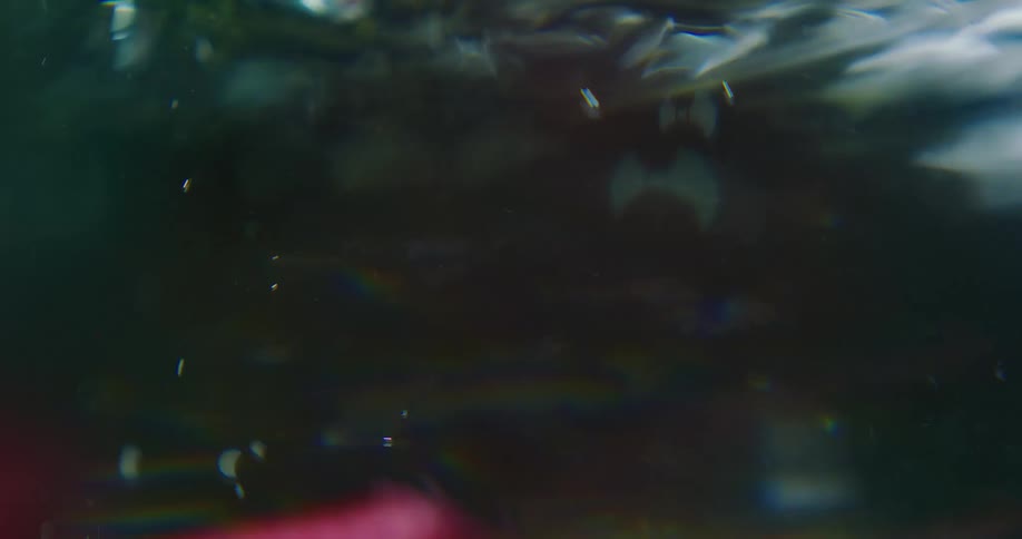 Silky pink fabric floats in water