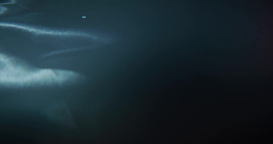 A black jacket shifting under water