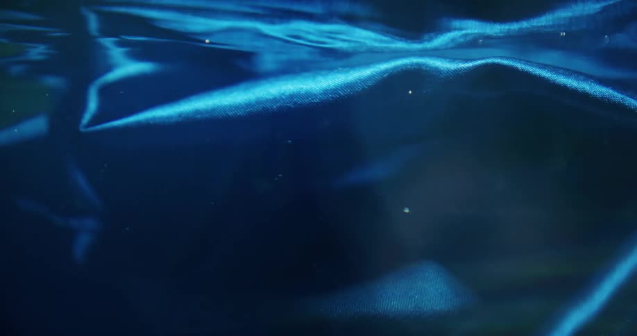 A blue clothe shifting in water