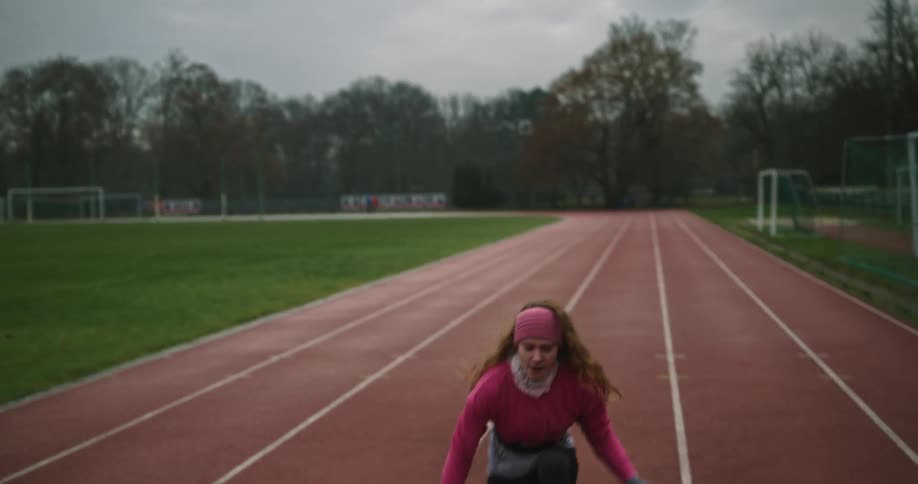 A woman races down the track