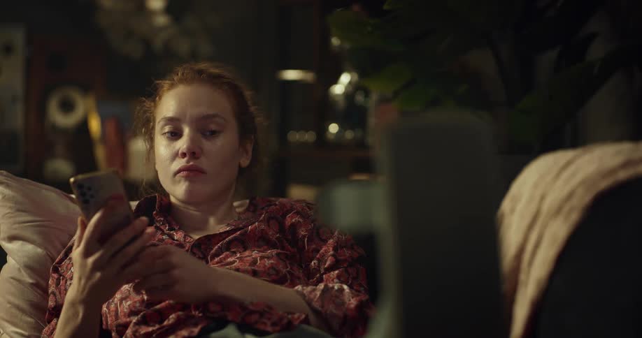 A woman talking on a phone talking about her leg