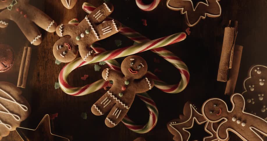 Gingerbread cookies and candy canes are on the table