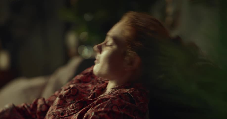 An injured woman takes some medication