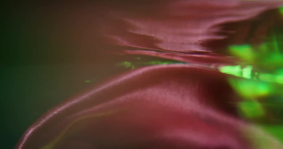 Water takes on color of bright fabric swirling through it