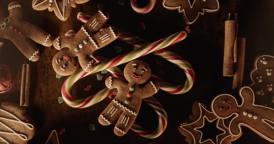 Overhead of gingerbread cookies and candy canes on display on a table