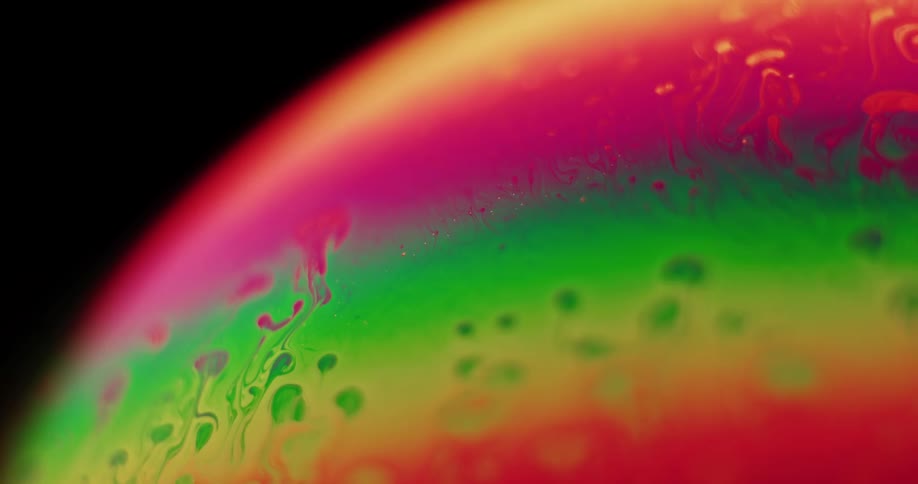 Close up view of paint colors mixing together