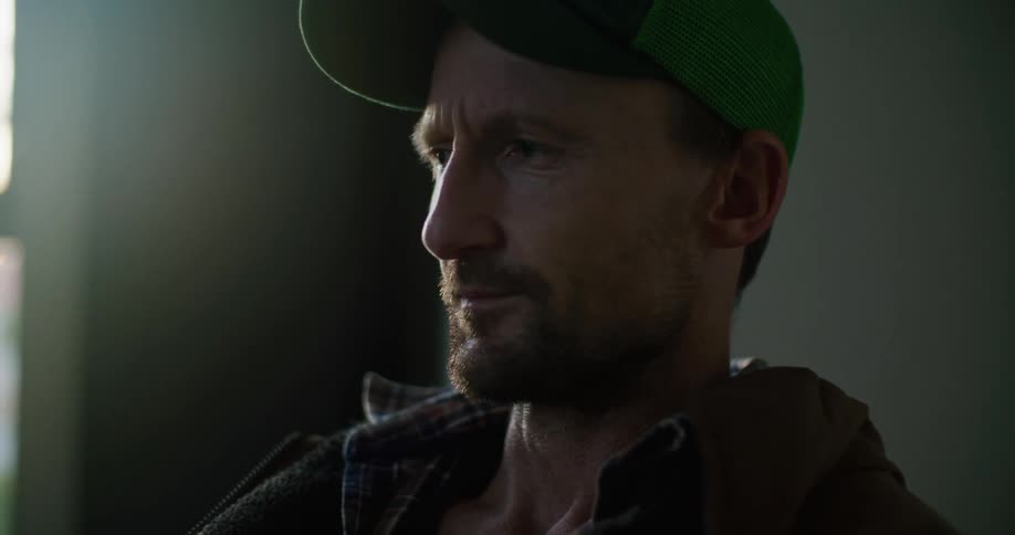 A man is speaking and looking around