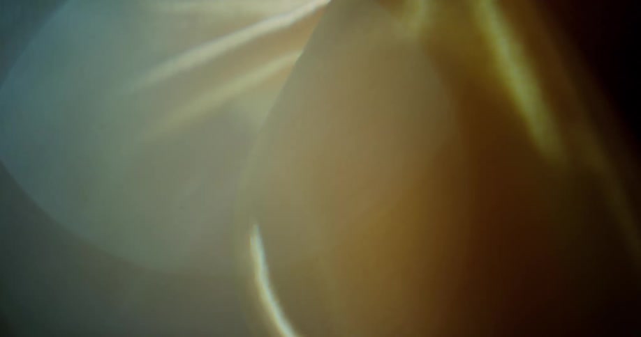 An up close of a cream colored silk sheet