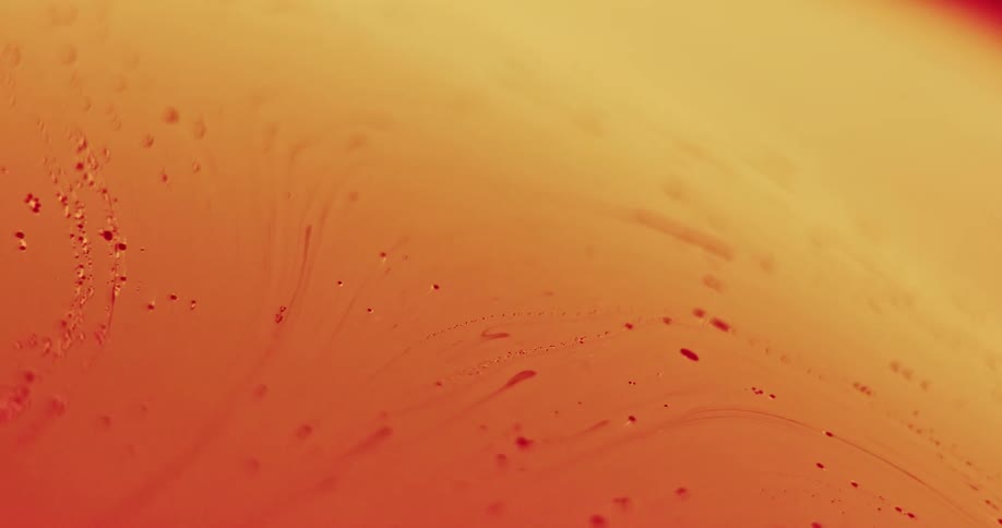 The orange liquid mixes around