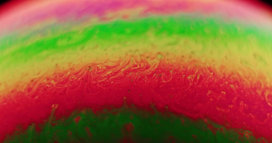 Different colors of paint are being mixed together