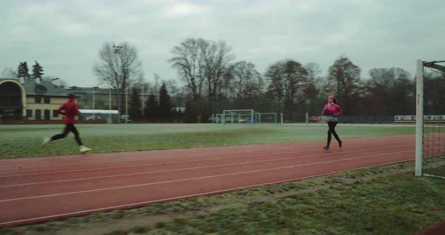 People are running on the track