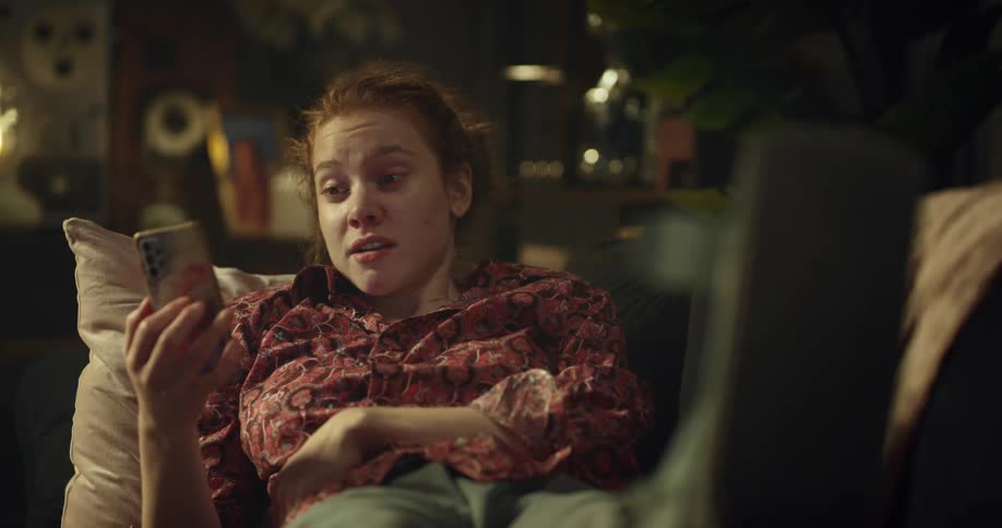 Woman talking on the phone while resting her leg