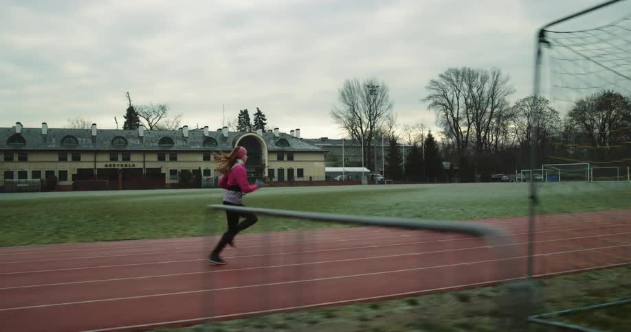 A woman is running on the track