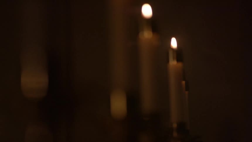 Candles are lit in a row
