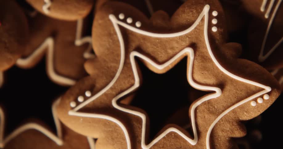 Iced gingerbread in man and star shapes are stacked