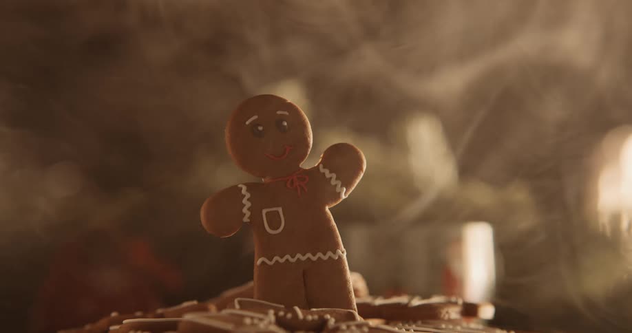 A gingerbread man is standing in a plate of cookies as smoke moves over the table