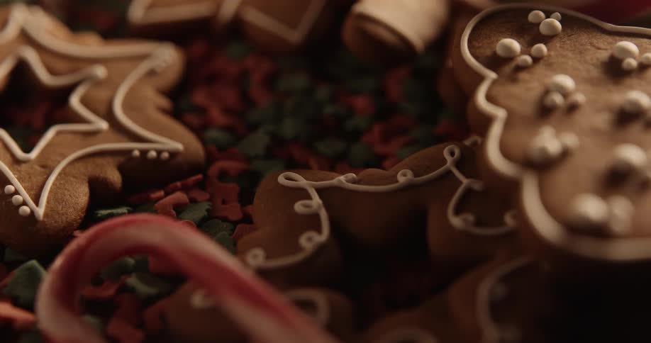 Holiday cookies are on a plate with a candy cane
