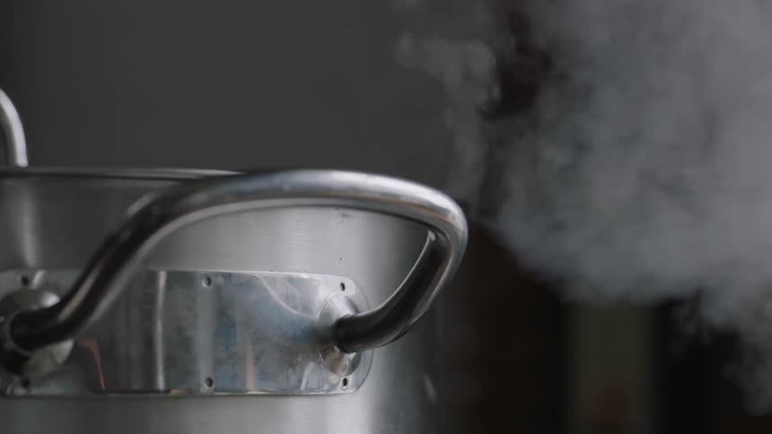 Steam rises off of a pot