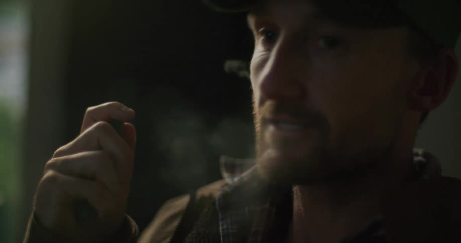 A man smoking a vape pen