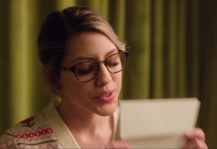 A woman kisses the envelope