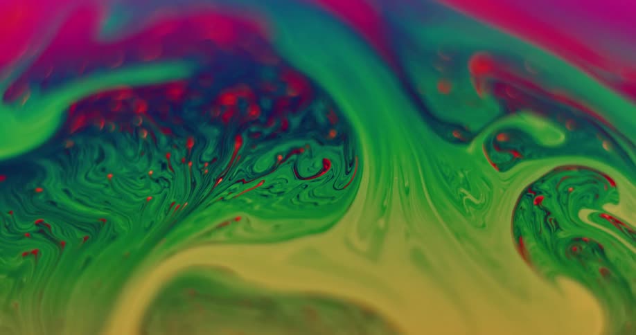 A fluorescent stripe of green blended with yellow moves up into red creating purple and variegated stripes move through the yellow