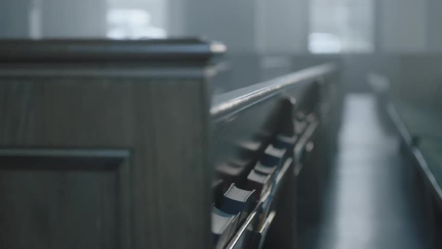 Church pews have bibles in slots