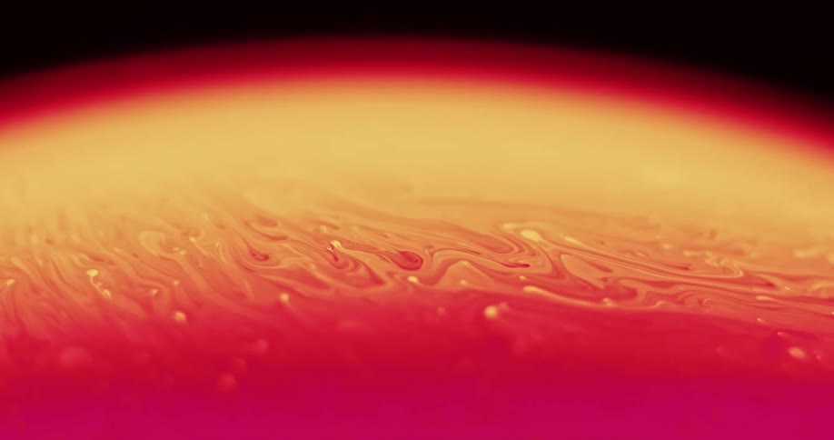 A mixture of yellow and red color moving in a wave to the left