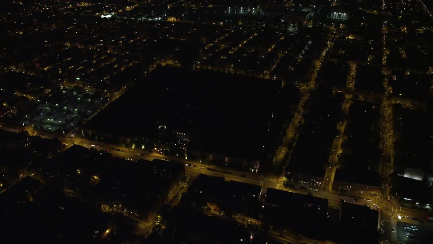 Aerial footage of historic Eastern State Penitentiary a government building and penal institution in North Philadelphia at night