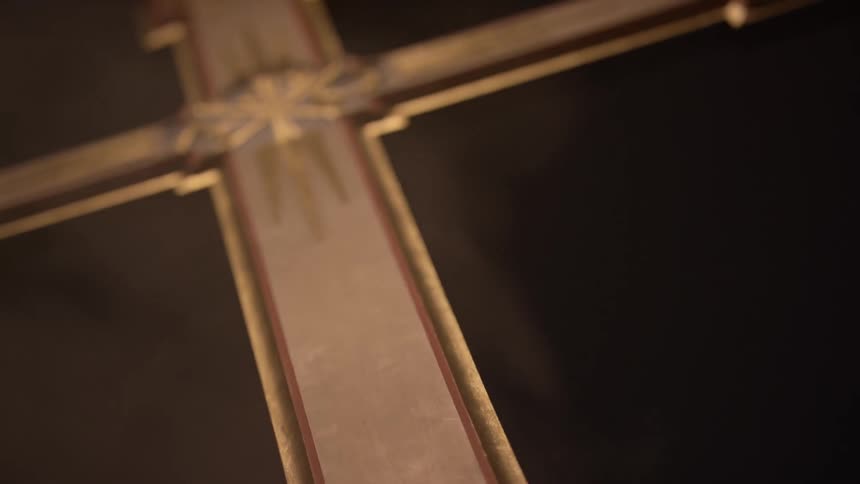 A cross is gold and white