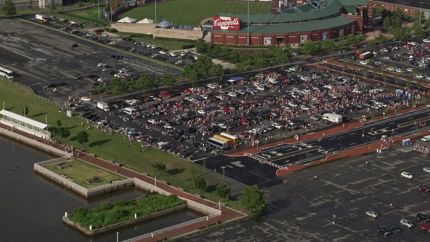 Aerial view of large crowds of people in parking lot