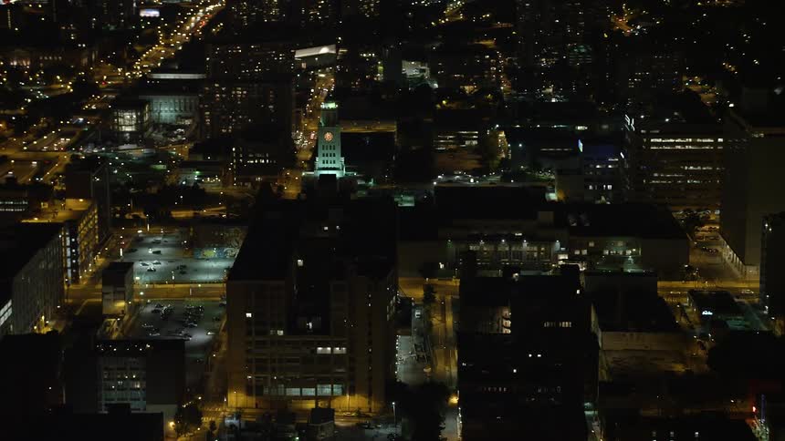A nighttime aerial view of the Inquirer Building clock tower in downtown Philadelphia Pennsylvania