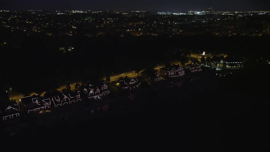 Aerial footage of Boathouse Row by the Schuylkill River at night in Philadelphia