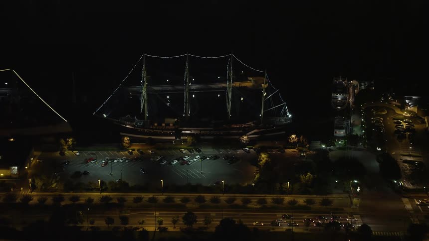 A historic ship Moshulu at night in Philadelphia Pennsylvania captured in aerial footage