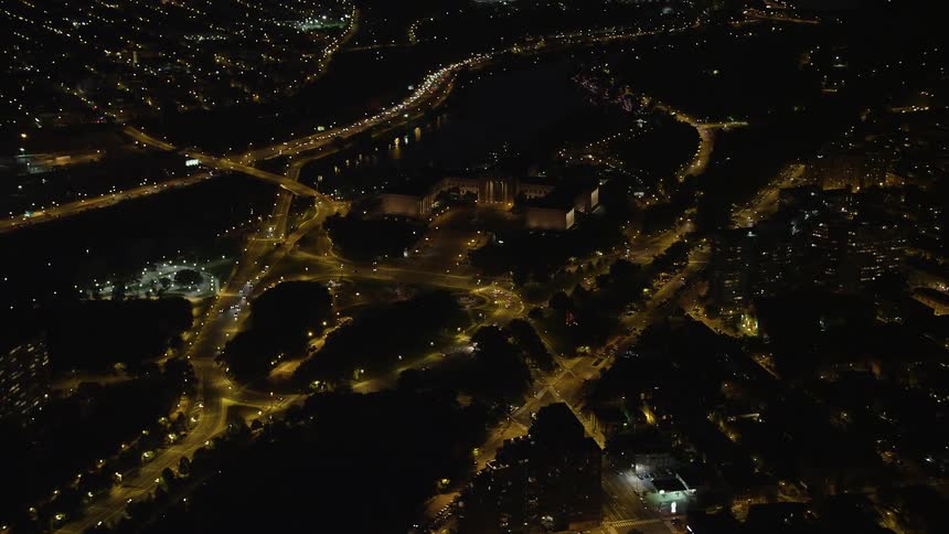 A stunning aerial view of Philadelphias illuminated art museum and The Oval park at night during the summer