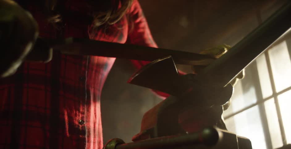A woman is sharpening a blade