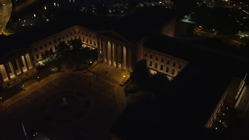 Aerial footage orbiting the Philadelphia Museum of Art and fountain at night