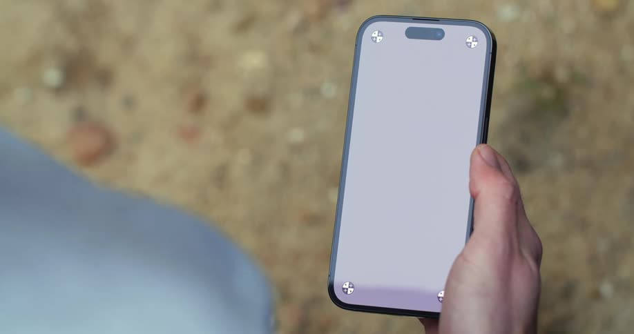 A man uses his thumb to swipe on his phone screen