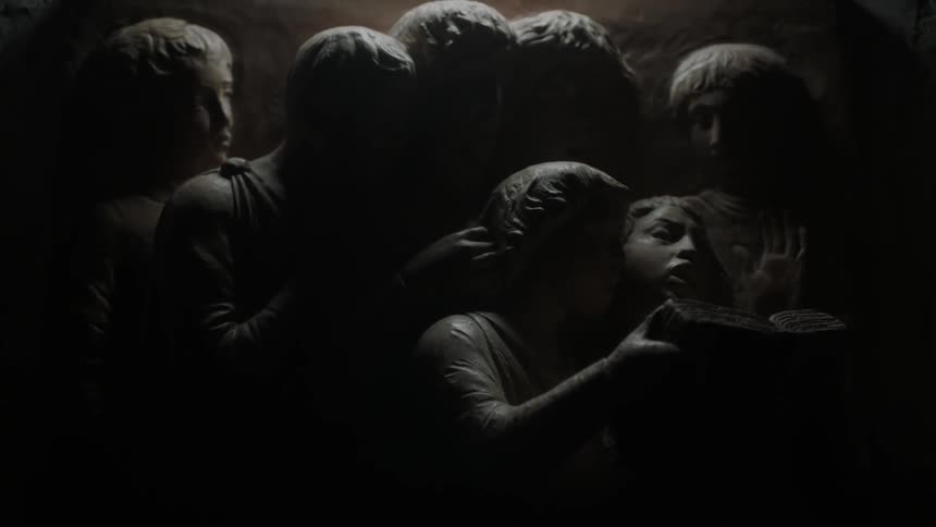A carving on a dark wall