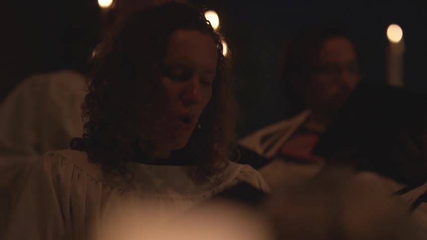 Congregation of people singing from their books