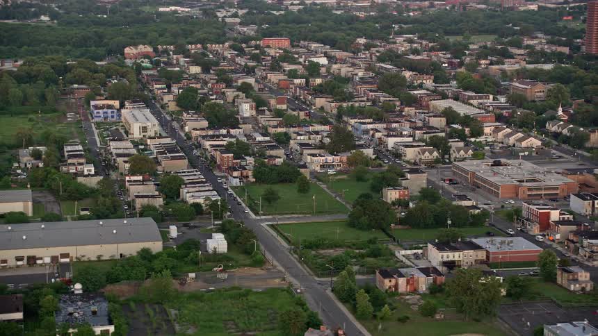Aerial footage of row houses in Camden NJ during sunset showing the residential neighborhood and urban landscapes