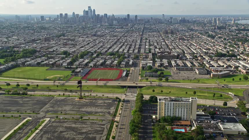An aerial view of buildings and streets in an urban area