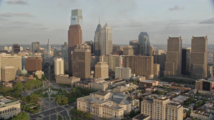 Approaching Philadelphia City Hall and skyscrapers in downtown Philadelphia during sunset