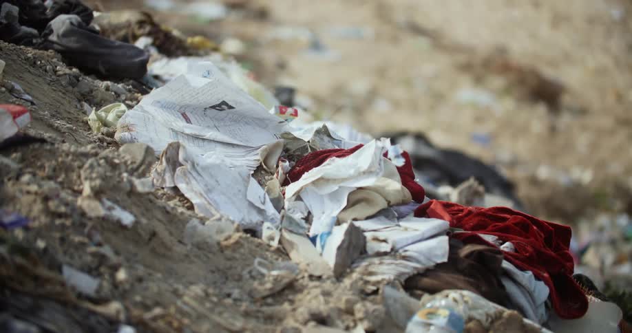 Pile of trash flowing in the breeze on the ground