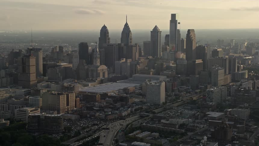 Aerial footage of the Downtown Philadelphia skyline and Pennsylvania Convention Center at sunset