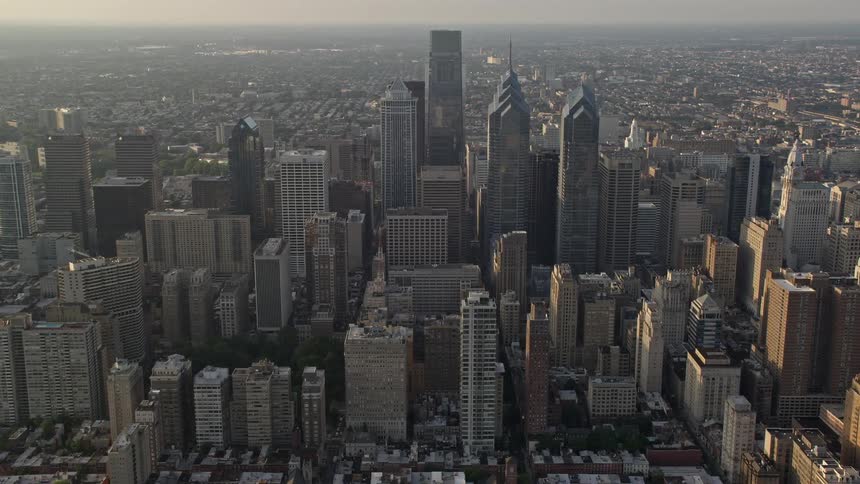 A stunning aerial view of downtown Philadelphia featuring the towering skyscrapers and high-rises at sunset