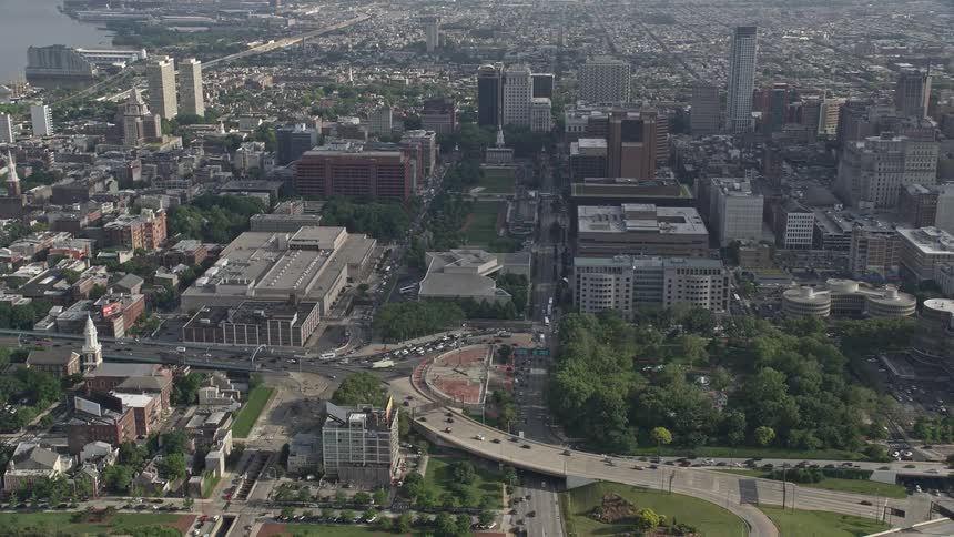 Aerial footage of Philadelphias Independence Hall at the end of Independence Mall approached from overhead with a tilt-down view and featuring partly cloudy skies historical landmarks and city recreation and tourism