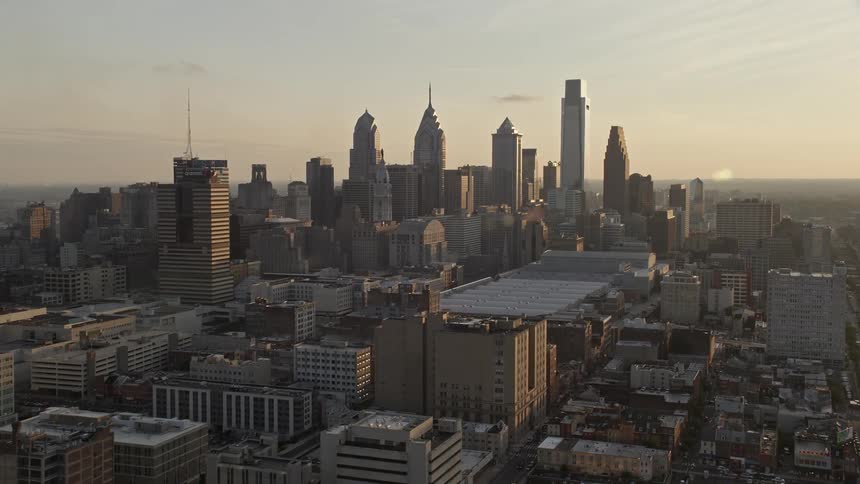 Approaching the Downtown Philadelphia skyline during sunset capturing the citys high rises skyscrapers and superstructures
