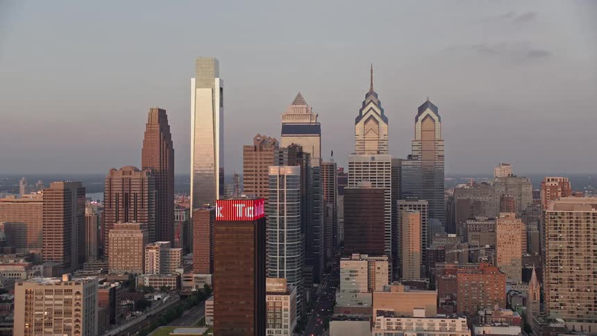 A stunning aerial view at sunset reveals the Cira Centre against the modern downtown Philadelphia skyline